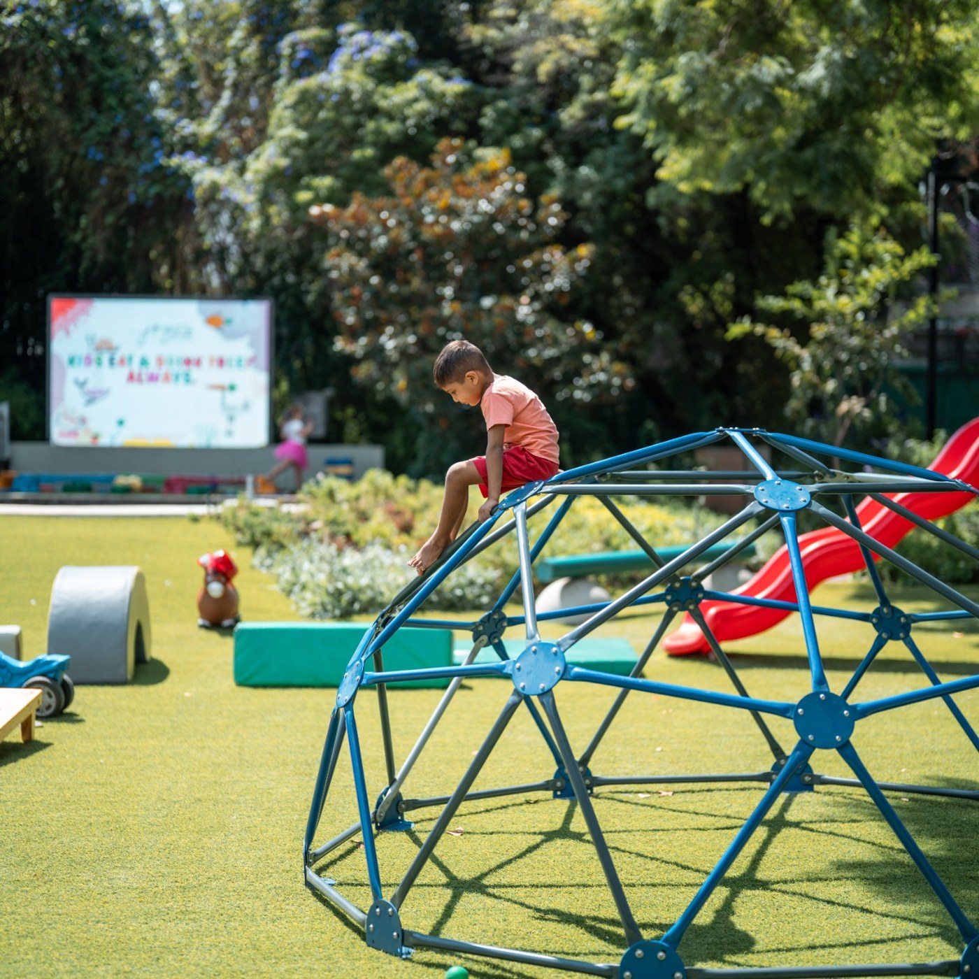 A child enjoying the outdoor play area at JoyJozi in Dunkeld, Johannesburg