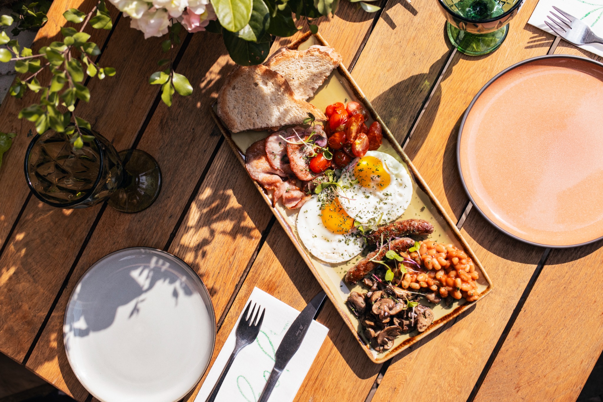 A breakfast spread plated on a wooden table