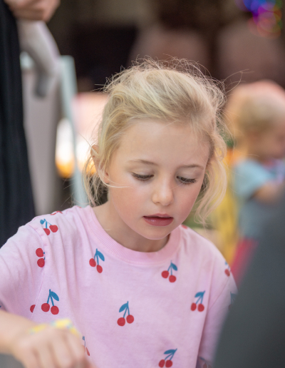 A child enjoying a creative JoyJozi party activity