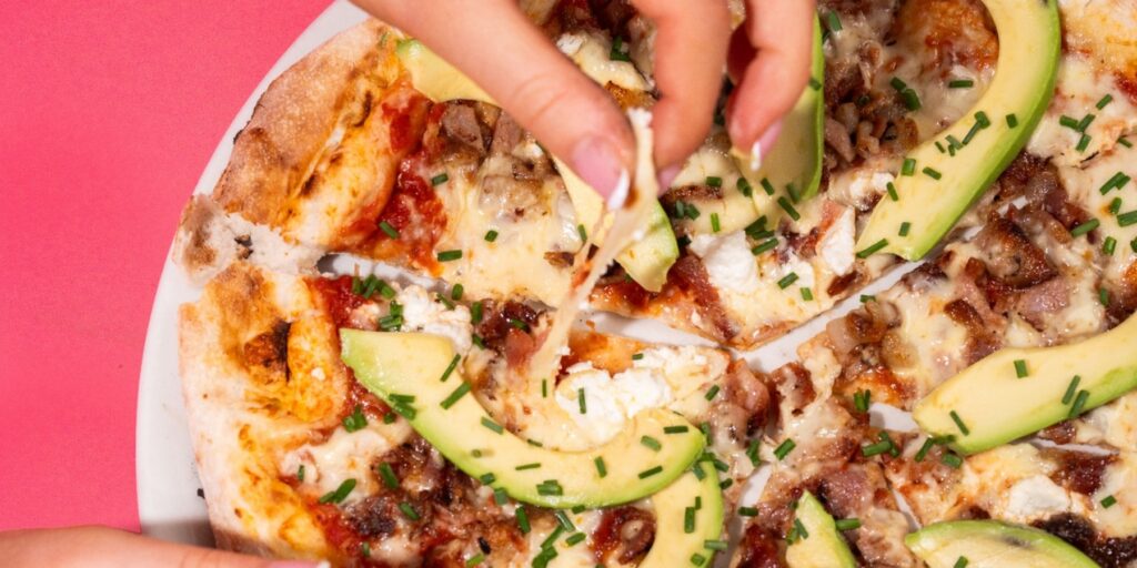 Pizza being served at JoyJozi restaurant for a family celebration