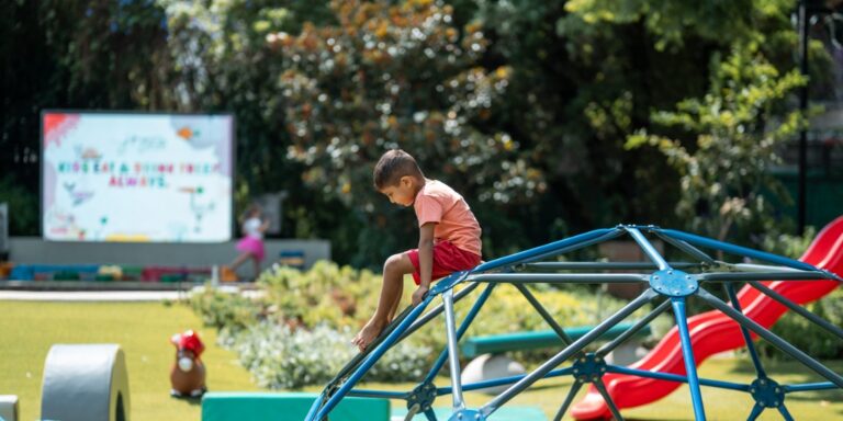 Child enjoying the outdoor climbing dome at JoyJozi in Dunkeld Johannesburg